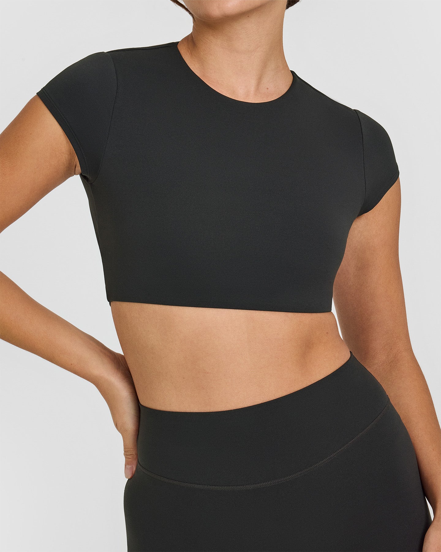 SoftMotionâ„¢ Short Sleeve Crop Top with White Logo | Soft Black