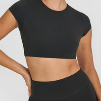 SoftMotionâ„¢ Short Sleeve Crop Top with White Logo | Soft Black