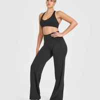 SoftMotionâ„¢ Bralette with White Logo | Soft Black