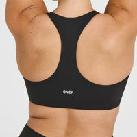 SoftMotionâ„¢ Bralette with White Logo | Soft Black