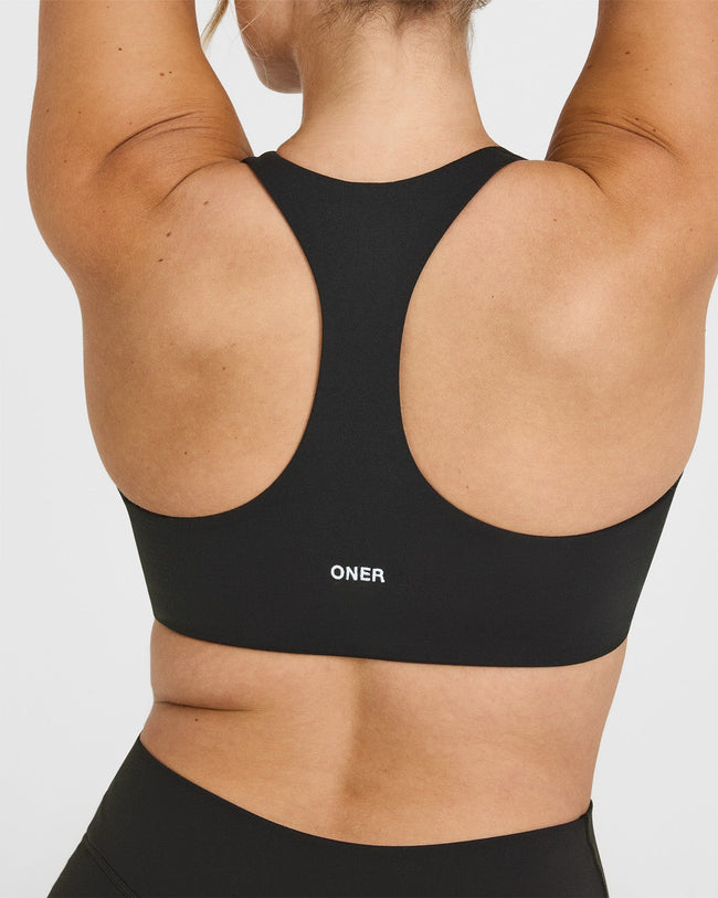 SoftMotionâ„¢ Bralette with White Logo | Soft Black