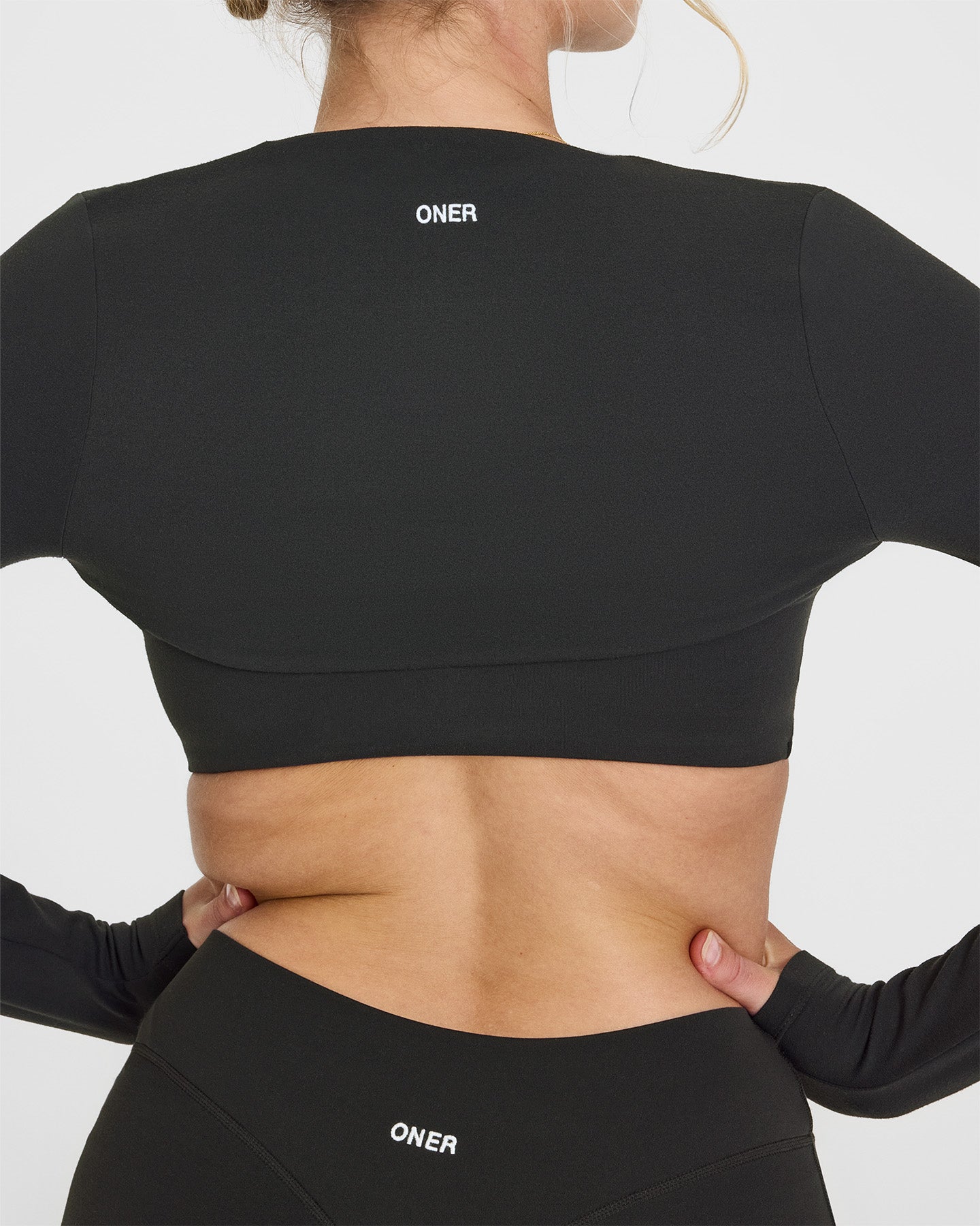 SoftMotionâ„¢ Long Sleeve Shrug with White Logo | Soft Black