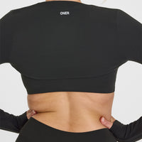 SoftMotionâ„¢ Long Sleeve Shrug with White Logo | Soft Black
