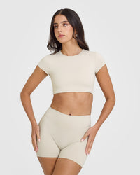 SoftMotionâ„¢ Short Sleeve Crop Top with White Logo | Sand