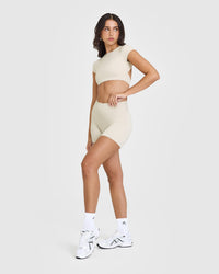 SoftMotionâ„¢ Short Sleeve Crop Top with White Logo | Sand