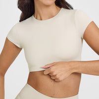 SoftMotionâ„¢ Short Sleeve Crop Top with White Logo | Sand
