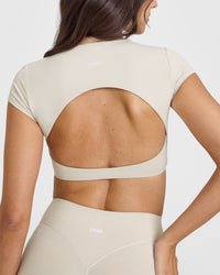 SoftMotionâ„¢ Short Sleeve Crop Top with White Logo | Sand