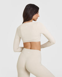 SoftMotionâ„¢ Long Sleeve Shrug with White Logo | Sand