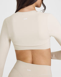 SoftMotionâ„¢ Long Sleeve Shrug with White Logo | Sand