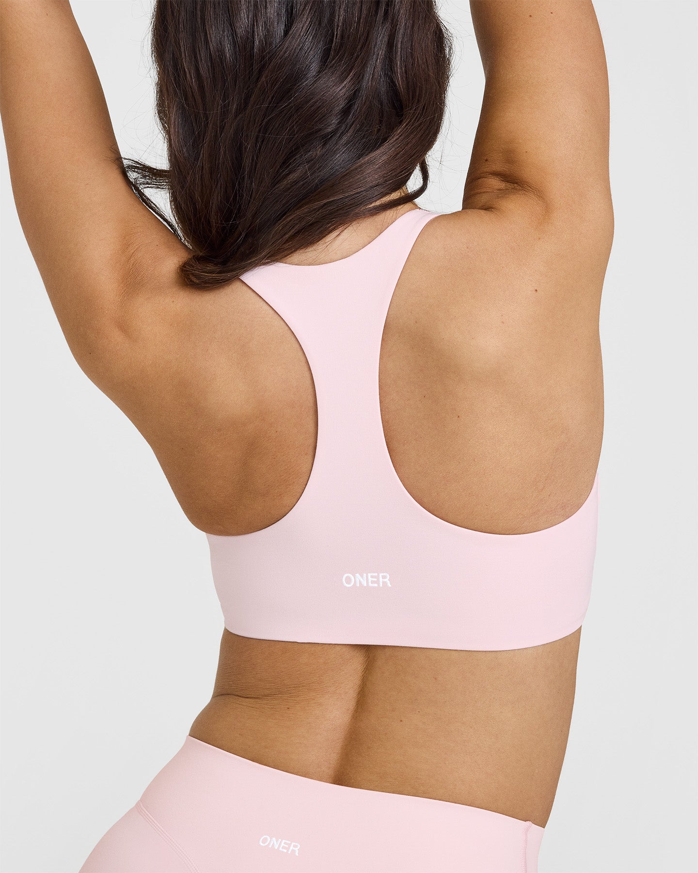 SoftMotionâ„¢ Sports Bra with White Logo | Ballet Pink