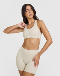 SoftMotionâ„¢ Sports Bra with White Logo | Sand