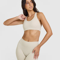 SoftMotionâ„¢ Sports Bra with White Logo | Sand