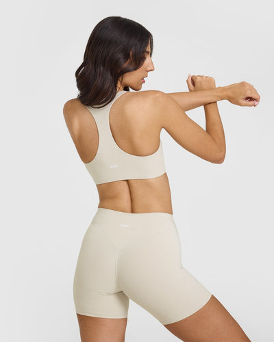 SoftMotionâ„¢ Sports Bra with White Logo | Sand