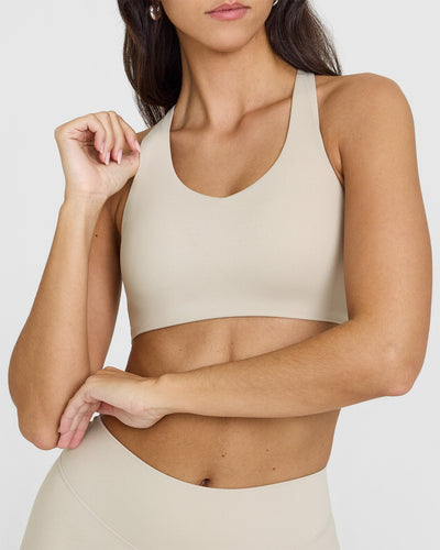 SoftMotionâ„¢ Sports Bra with White Logo | Sand