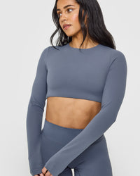 SoftMotionâ„¢ Long Sleeve Crop Top with White Logo | Granite Blue