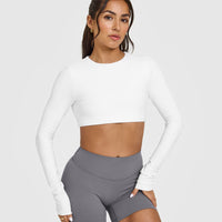 SoftMotionâ„¢ Long Sleeve Crop Top with White Logo | White