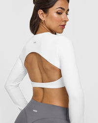 SoftMotionâ„¢ Long Sleeve Crop Top with White Logo | White
