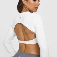 SoftMotionâ„¢ Long Sleeve Crop Top with White Logo | White