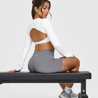 SoftMotionâ„¢ Long Sleeve Crop Top with White Logo | White