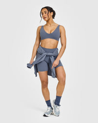 SoftMotionâ„¢ Scoop Back Bralette with White Logo | Granite Blue