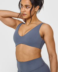 SoftMotionâ„¢ Scoop Back Bralette with White Logo | Granite Blue
