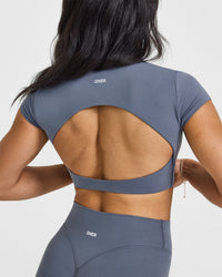 SoftMotionâ„¢ Short Sleeve Crop Top with White Logo | Granite Blue