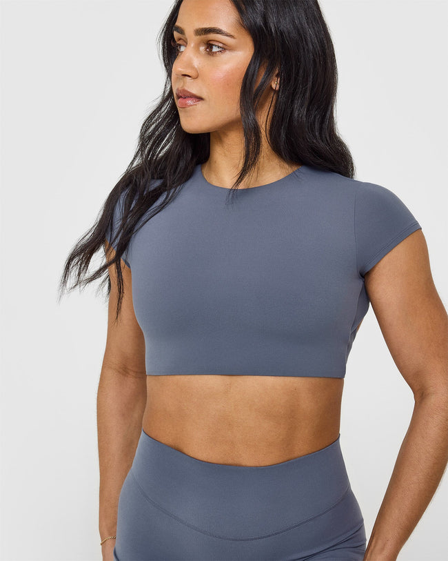SoftMotionâ„¢ Short Sleeve Crop Top with White Logo | Granite Blue