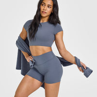 SoftMotionâ„¢ Short Sleeve Crop Top with White Logo | Granite Blue