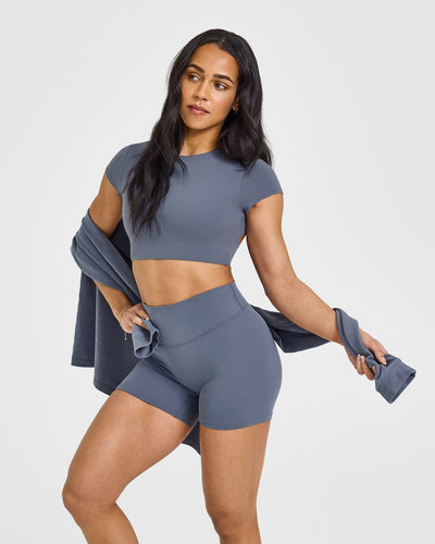 SoftMotionâ„¢ Short Sleeve Crop Top with White Logo | Granite Blue