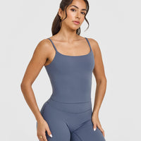 SoftMotionâ„¢ Strappy Mid Vest with Built in Bra Shelf with White Logo | Granite Blue