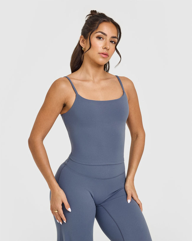 SoftMotionâ„¢ Strappy Mid Vest with Built in Bra Shelf with White Logo | Granite Blue