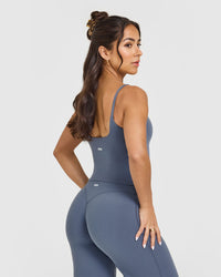 SoftMotionâ„¢ Strappy Mid Vest with Built in Bra Shelf with White Logo | Granite Blue