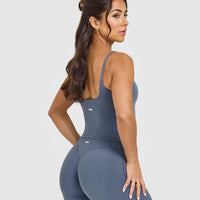SoftMotionâ„¢ Strappy Mid Vest with Built in Bra Shelf with White Logo | Granite Blue