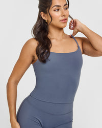 SoftMotionâ„¢ Strappy Mid Vest with Built in Bra Shelf with White Logo | Granite Blue