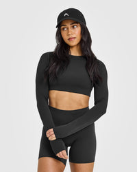 SoftMotionâ„¢ Long Sleeve Crop Top with White Logo | Soft Black