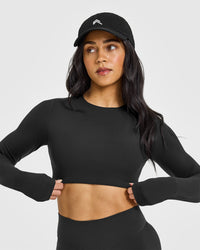 SoftMotionâ„¢ Long Sleeve Crop Top with White Logo | Soft Black