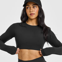 SoftMotionâ„¢ Long Sleeve Crop Top with White Logo | Soft Black