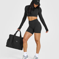 SoftMotionâ„¢ Long Sleeve Crop Top with White Logo | Soft Black