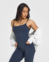 SoftMotionâ„¢ Strappy Mid Vest with Built in Bra Shelf with White Logo | True Blue