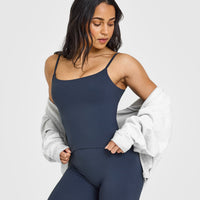 SoftMotionâ„¢ Strappy Mid Vest with Built in Bra Shelf with White Logo | True Blue