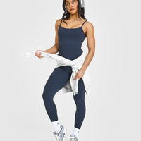 SoftMotionâ„¢ Strappy Mid Vest with Built in Bra Shelf with White Logo | True Blue
