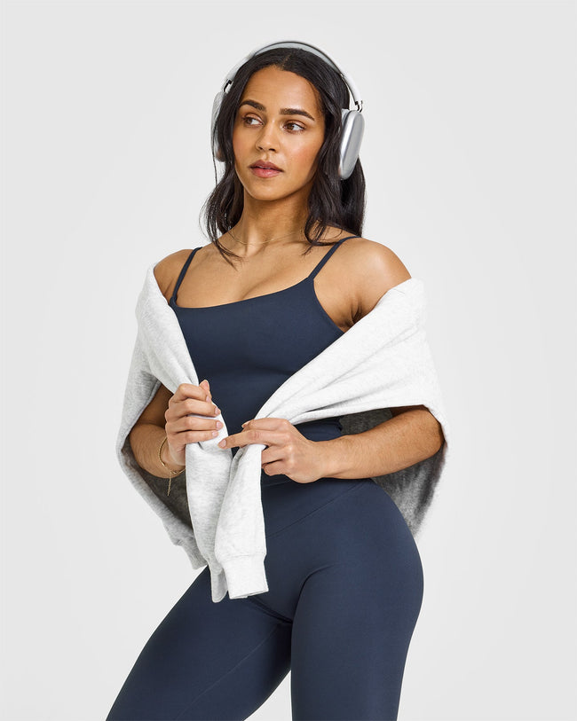 SoftMotionâ„¢ Strappy Mid Vest with Built in Bra Shelf with White Logo | True Blue