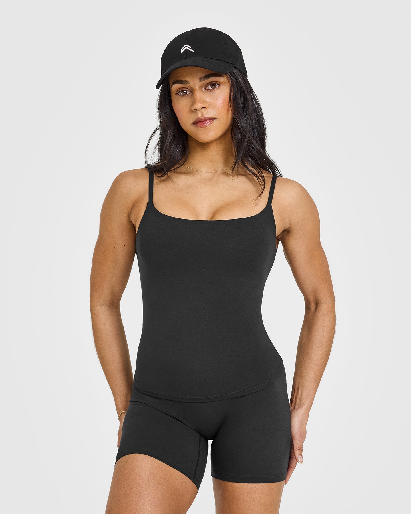 SoftMotionâ„¢ Strappy Vest with Built in Bra Shelf with White Logo | Soft Black