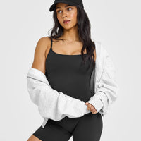 SoftMotionâ„¢ Strappy Vest with Built in Bra Shelf with White Logo | Soft Black