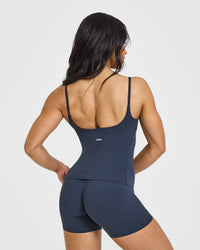 SoftMotionâ„¢ Strappy Vest with Built in Bra Shelf with White Logo | True Blue