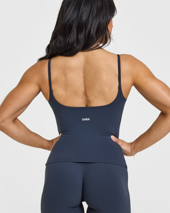 SoftMotionâ„¢ Strappy Vest with Built in Bra Shelf with White Logo | True Blue
