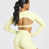 SoftMotionâ„¢ Long Sleeve Crop Top with White Logo | Pastel Yellow