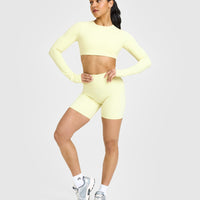 SoftMotionâ„¢ Long Sleeve Crop Top with White Logo | Pastel Yellow