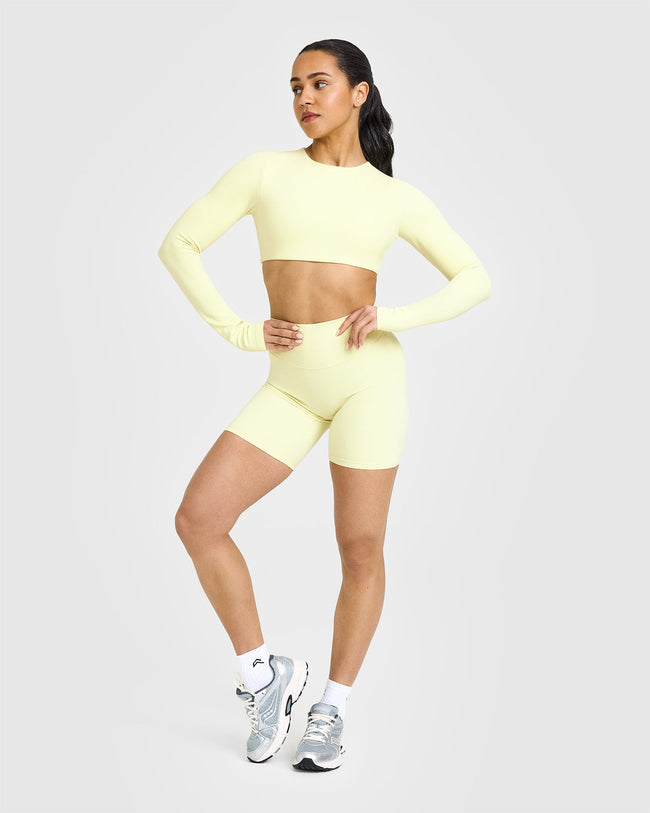 SoftMotionâ„¢ Long Sleeve Crop Top with White Logo | Pastel Yellow