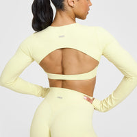 SoftMotionâ„¢ Long Sleeve Crop Top with White Logo | Pastel Yellow